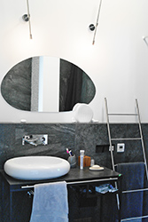 Pebble shaped mirror, pebble shaped sink.