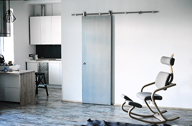 Vintage Danish modern chair Duo Balans by Peter Oprsvik, sliding bathroom door and open kitchen.