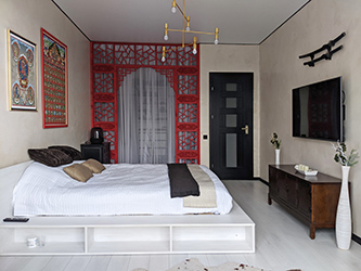 This design was created around numerous Tibetan Buddhist items I've gathered from my time in Nepal. Many elements were ordered from China making this apartment a very special case of &laquo;made in China&raquo; meaning being purely authentic. The elements of the room divider, for example, were handmade in China.