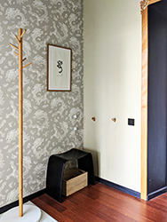 Oriental dragon wallpaper, Tibetan calligraphy and special liquid-proof floor to mark entry area. Winters in Kyiv get snowy and it's good to have extra durable floor by the entrance.